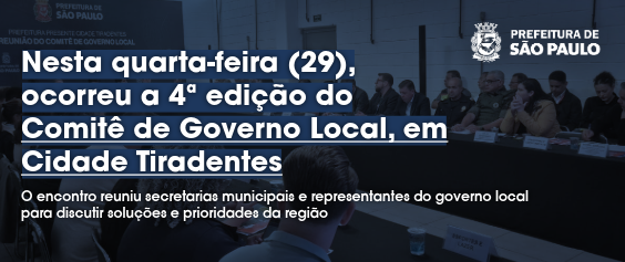 A imagem é um card ou post informativo que utiliza uma fotografia de fundo escurecida para veicular uma mensagem sobre um evento da Prefeitura de São Paulo. A foto, que ocupa a maior parte da imagem, mostra um trecho de uma Reunião do Comitê de Governo Local em Cidade Tiradentes, com participantes sentados à mesa. No canto superior direito, o logotipo e brasão da Prefeitura de São Paulo são exibidos. Sobreposta à foto, uma manchete em texto grande, branco e em negrito informa: 